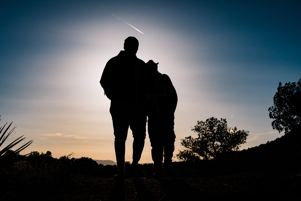 A couple looking out at an Arizona sunset
