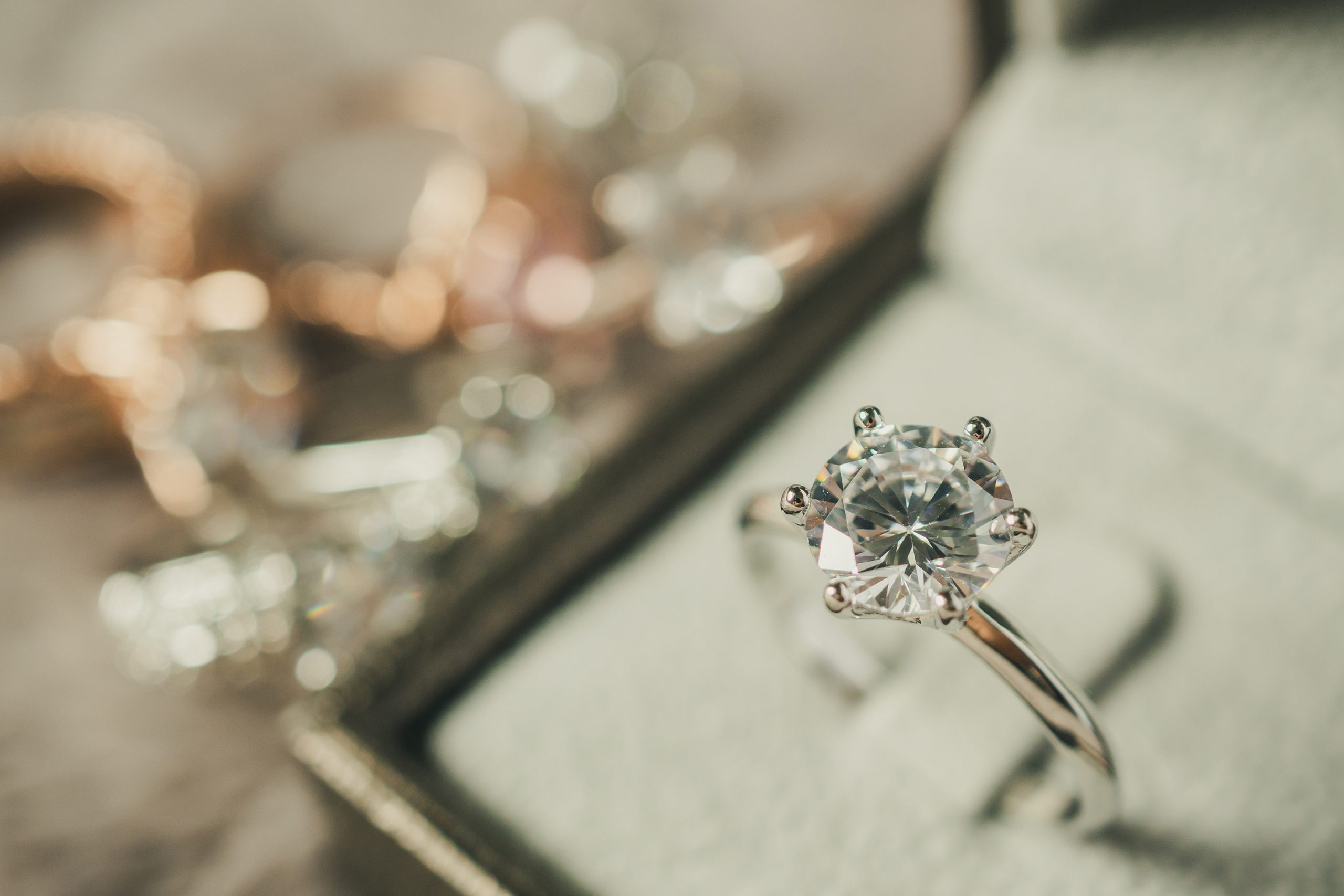 A close up of an engagement ring in a display case