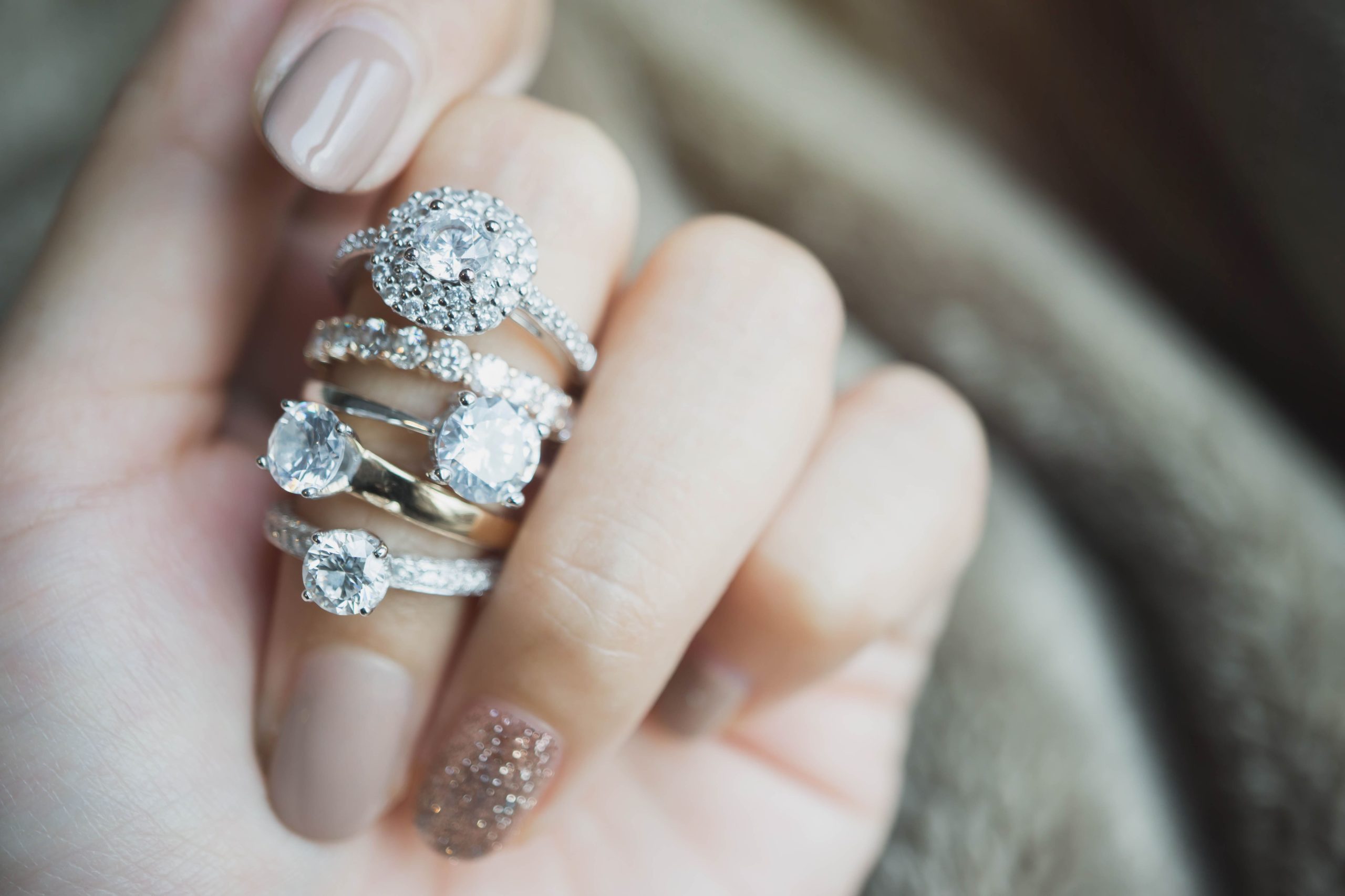 woman wearing multiple wedding rings