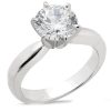 A silver engagement ring features a large, round diamond prominently set in a six-prong mounting.
