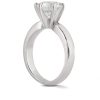 A silver engagement ring with a large, clear diamond set in a six-prong mounting.