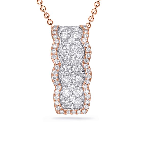 A rose gold necklace features a pendant with a set of three prominent diamonds surrounded by smaller diamonds.