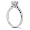 A silver engagement ring with a round diamond is prominently displayed against a white background.
