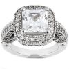 A silver ring featuring a large, square-cut clear gemstone surrounded by smaller accent stones.
