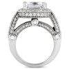A silver ring with a large, rectangular diamond surrounded by small, round diamonds is displayed from the side.