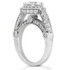 A silver engagement ring with a central round-cut diamond and smaller surrounding diamonds on the band.