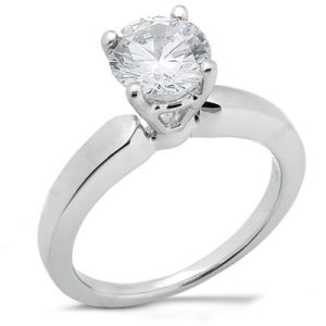 A silver engagement ring with a large round diamond set in a four-prong setting.