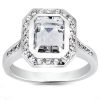 An elegant silver ring features a large, rectangular clear gemstone surrounded by smaller diamonds.