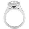 A silver engagement ring with a square-cut center diamond and smaller side stones.