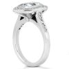 A silver ring with a large rectangular gemstone and smaller accents is displayed prominently.