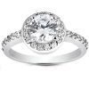 A silver engagement ring features a large round diamond at the center, surrounded by smaller diamonds along the band.