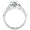 A silver ring features a large central clear gemstone surrounded by smaller stones on the band.