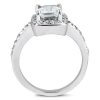 A silver ring with a large rectangular gemstone and smaller accents along the band is displayed from an angled front view.