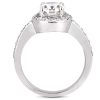 A silver ring features a large clear gemstone surrounded by smaller stones along the band.