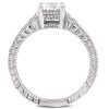 A silver engagement ring with a large square-cut diamond held in a detailed prong setting.