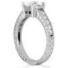 A silver engagement ring features a prominent round gemstone and intricate detailing along the band.