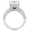 A diamond engagement ring features a large central stone and smaller stones set along the band.