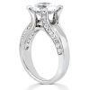 A silver engagement ring with a large clear diamond and smaller diamonds set along the band.
