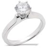 A silver engagement ring featuring a large round diamond at the center.