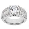 A silver ring with a large round diamond surrounded by smaller diamonds is displayed prominently.