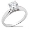 A silver ring features a large round diamond at its center.