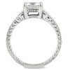 A silver ring with a large central diamond and intricate band detailing is displayed against a white background.