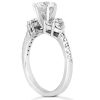 Three-stone diamond engagement ring with a prominent central diamond set in white gold.