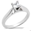 A silver engagement ring features a princess-cut diamond set in a four-prong setting.