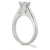 A silver engagement ring with a prominent diamond setting is displayed from the side.