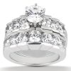 A silver jewelry ring featuring a large central diamond surrounded by smaller diamonds in a stacked design.