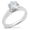 A silver engagement ring featuring a large round diamond set in a six-prong mounting.