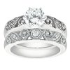 A diamond engagement ring set featuring a large central stone and a decorative band with intricate designs.