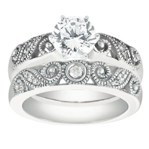 A diamond engagement ring set featuring a large central stone and a decorative band with intricate designs.