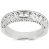A silver ring with a row of sparkling clear stones along the top surface.
