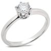 A silver engagement ring featuring a round, solitaire diamond setting.
