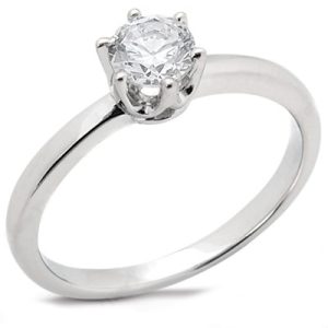 A silver engagement ring featuring a round, solitaire diamond setting.