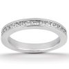 A silver wedding band with a row of clear gemstones embedded along the top edge.
