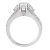 A silver engagement ring features a large center diamond flanked by two smaller diamonds on either side.