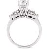 A silver ring features a large central transparent stone surrounded by smaller stones on each side.