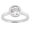 A silver ring featuring a round, clear diamond at its center.