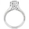 A diamond engagement ring with a central stone and a band featuring smaller diamonds along the sides.