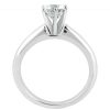 A silver engagement ring with a large, clear diamond set prominently at the top.