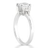 A white gold engagement ring featuring a square diamond surrounded by smaller diamonds.