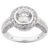 A silver ring features a large central diamond surrounded by smaller diamonds in a circular setting.