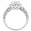 A silver engagement ring features a large central diamond surrounded by smaller stones along the band.