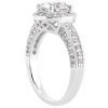 A silver engagement ring with a large round center stone and a decorative band featuring smaller embedded stones.