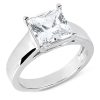 A silver engagement ring featuring a large, square-cut clear gemstone.