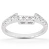A silver ring with a row of small diamonds on the band and a cluster of larger diamonds at the center.