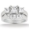 A silver ring featuring multiple sparkling, rectangular cut gemstones.
