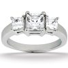 A silver three-stone ring features two square-shaped clear stones flanking a larger central clear stone.
